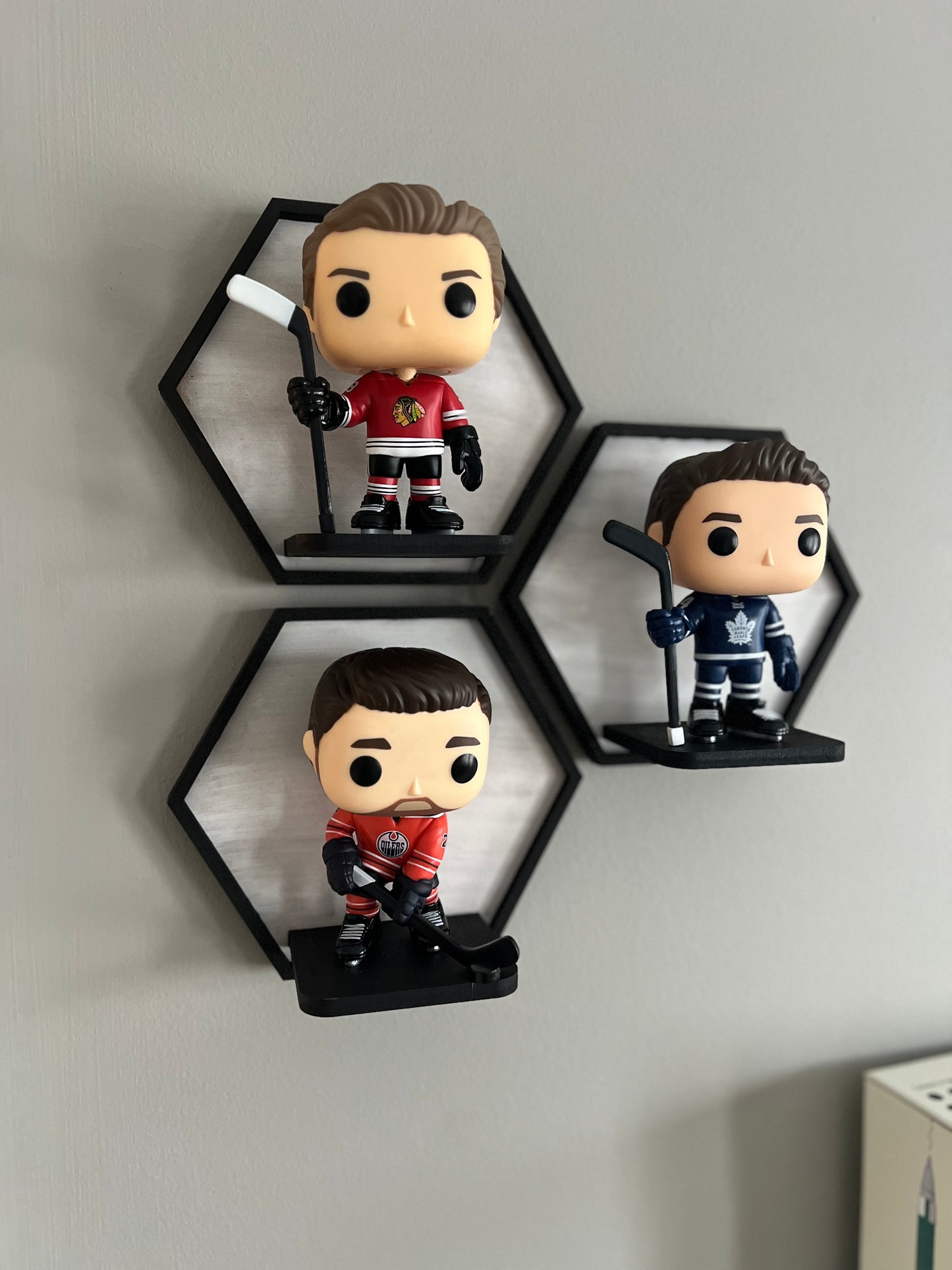Hexagonal Wall Display tiles for figurines like Funko Pops and Brickheadz. Available at The Friendly Canadian Store