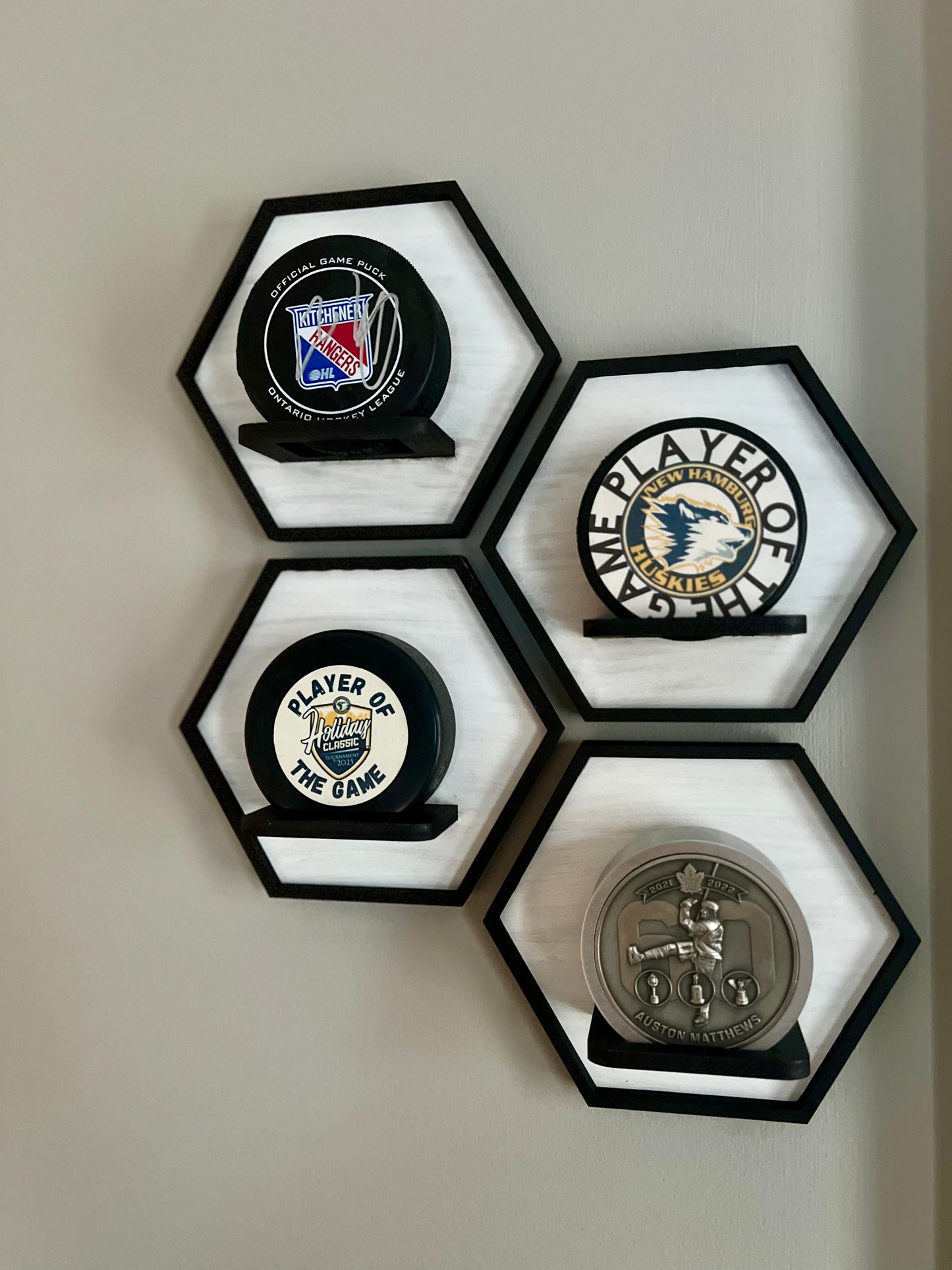 Hexagonal Wall Display tiles for your hockey puck collection. Available at The Friendly Canadian Store